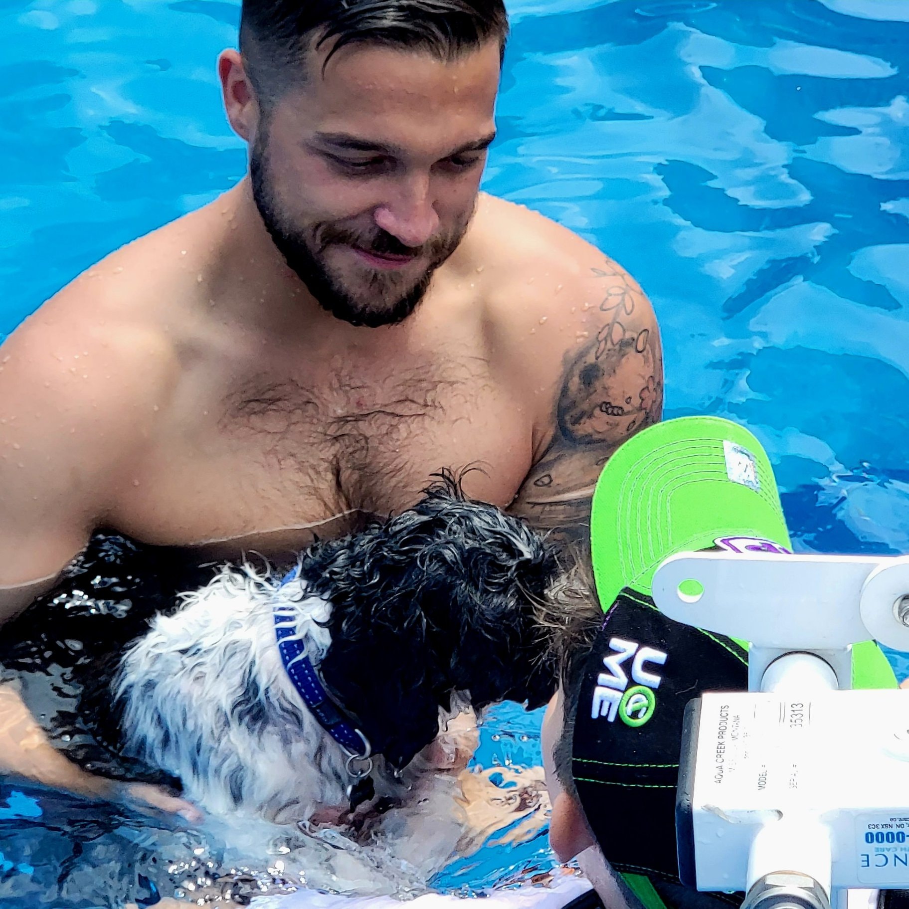 Support worker enjoying a pool activity with a participant and their dog